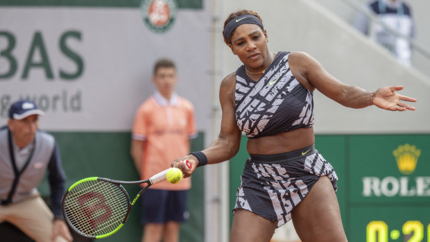 New-look: Serena Williams playing in her latest outfit at the French Open.