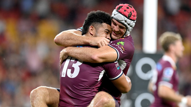 Paisami and Fraser McReight celebrate.