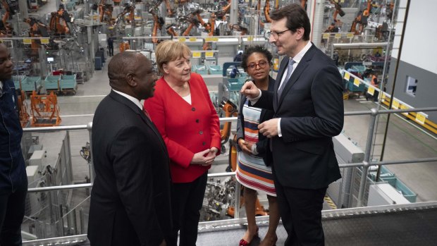 German Chancellor Angela Merkel, in South Africa with President Cyril Ramaphosa, left, said the result must be reversed.