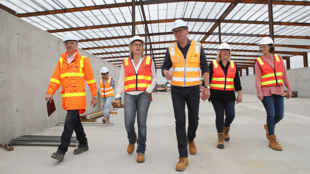 Victorian Premier Daniel Andrews and Transport Minister Jacinta Allan (second left) tour the West Gate Tunnel site.