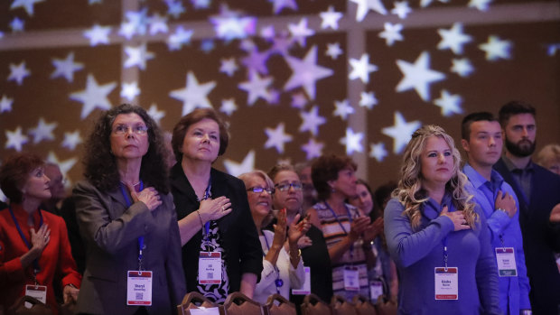 Attendees stand for the American national anthem at the Values Voter Summit, a forum held each year in Washington.