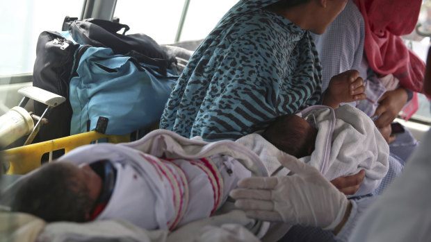Babies are taken away by ambulance after gunmen attacked a maternity hospital in Kabul, Afghanistan.