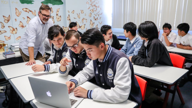 Blakehurst High School's eSports team talk League of Legends tactics in the classroom. 