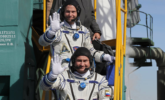 Russian cosmonaut Alexey Ovchinin (front) and US astronaut Nick Hague prior to launch.