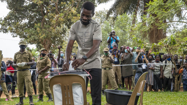 Bobi Wine votes in Kampala in a presidential election tainted by widespread violence.