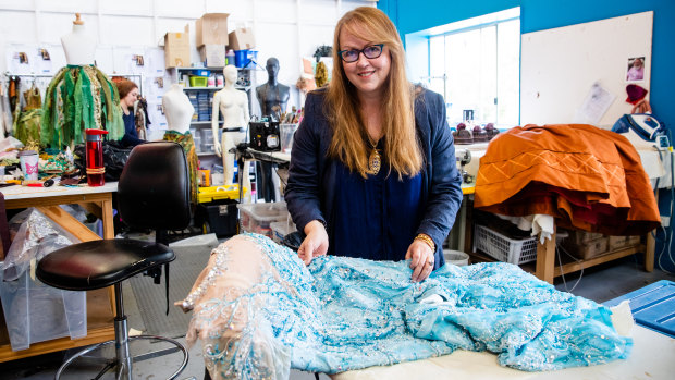 Janet Hine with Elsa's famous ice dress, which weighs about eight kilograms and is covered in 14,000 beads. 