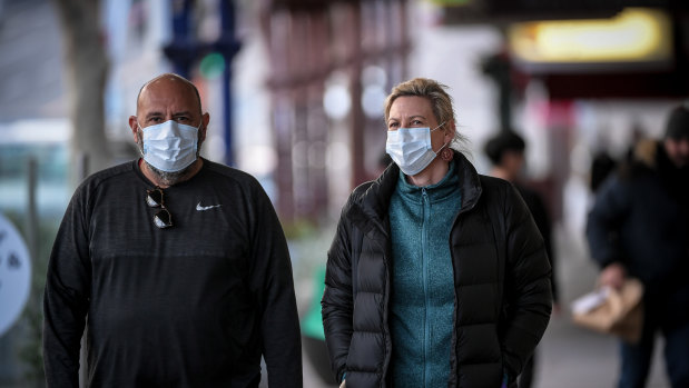 Mask-wearing on Lygon Street in Carlton.