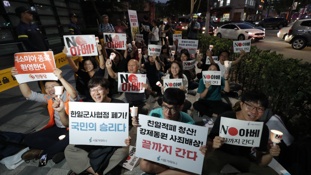 South Korean protesters react during a rally about the General Security of Military Information Agreement, or GSOMIA, in front of the Japanese embassy in Seoul, South Korea.