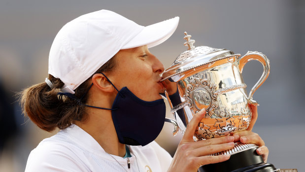 Iga Swiatek of Poland kisses the Suzanne-Lenglen cup following victory in her Women's Singles Final against Sofia Kenin of The United States of America on day fourteen of the 2020 French Open at Roland Garros on October 10, 2020 in Paris, France. 