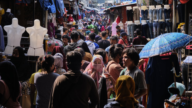 Indonesians crowd the Tanah Abang textile market to buy new clothing, a tradition for upcoming the Eid al Fitr holiday in Jakarta, Indonesia.