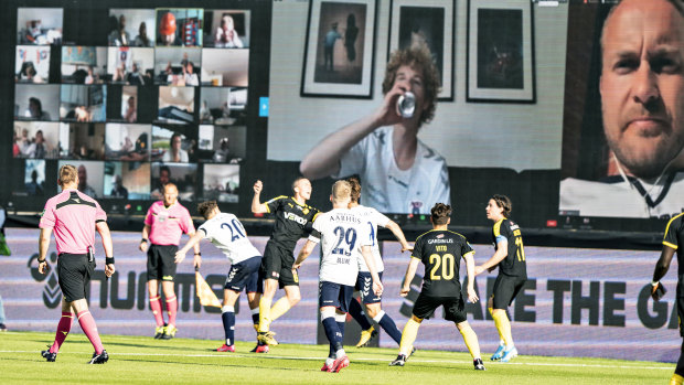 Danish fans are projected into the stadium via Zoom for the Superliga clash between Aarhus and Randers.