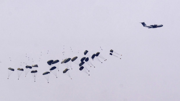 Parachutes drop supplies into the northern Gaza Strip, as seen from southern Israel this week.