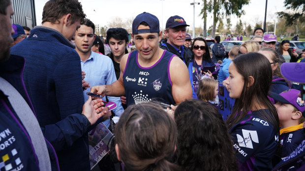 Nervous wait: Slater signs autographs at the Storm's fan day on Monday.
