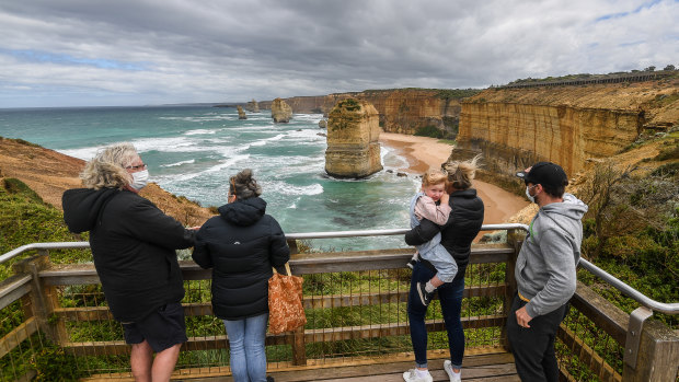 Locals Colin and Jean Dillon with  daughter Marnie Fitzpatrick, her husband Charlie and their toddler Mable at the unusually quiet lookout at the Twelve Apostles last week.