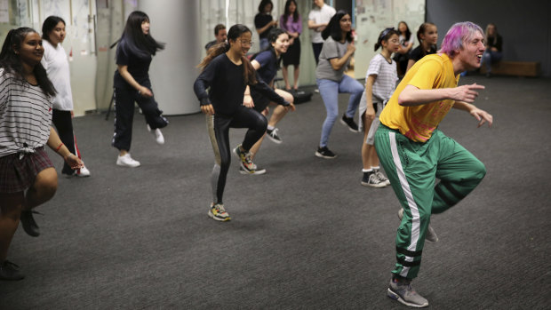 Children run through K-Pop dance moves under the instruction of choreographer David Ward at the Korean Cultural Centre.