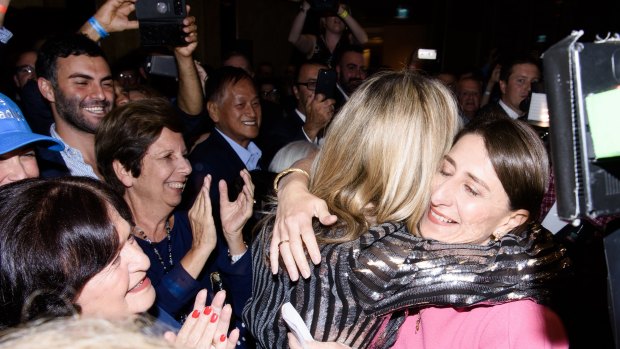 Gladys Berejiklian hugs her sister Mary.