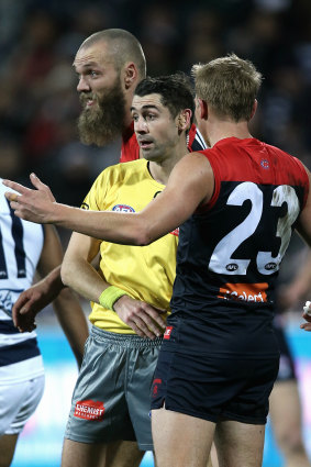 Melbourne's Bernie Vince argues with the umpire about the free kick awarded to Patrick Dangerfield.