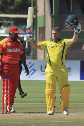 Aaron Finch notches his ton.