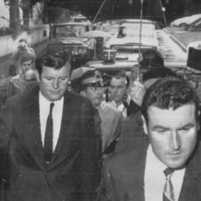 Sen. Edward M. Kennedy (centre) walks through rain into the Dukes County courthouse to face motor vehicle charges of leaving the scene of the accident that killed Mary Jo Kopechne. 
