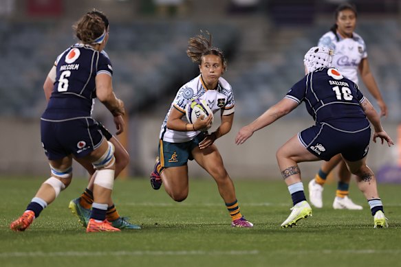 Teenage playmaker Waiaria Ellis steps through the Scotland defence in Canberra.