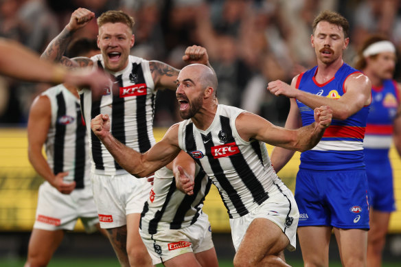 Steele Sidebottom of the Magpies celebrates a goal.