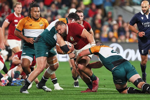 uke Cowan-Dickie of the British & Irish Lions is tackled by the AUNZ XV