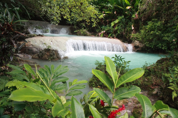 Mele Cascades, a series of pristine aquamarine pools terraced along a hillside.