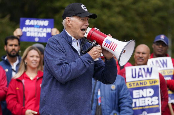 President Joe Biden with UAW strikers on a picket line earlier this week.
