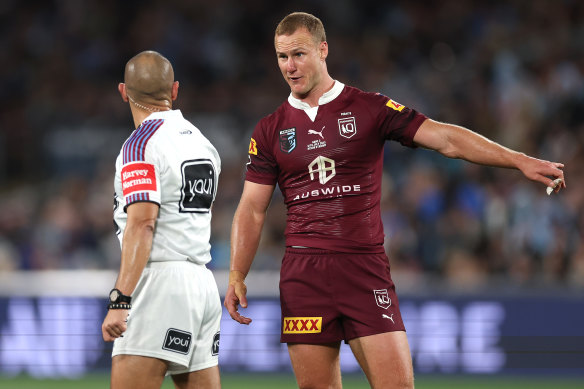 Maroons’ skipper Daly Cherry-Evans challenges the call of a knock-on.