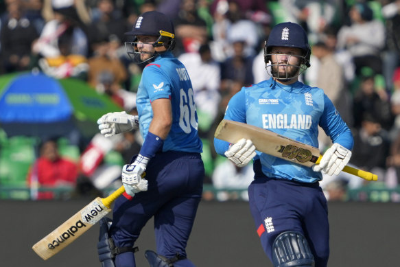 England’s Ben Duckett, right, and Joe Root run between the wickets.
