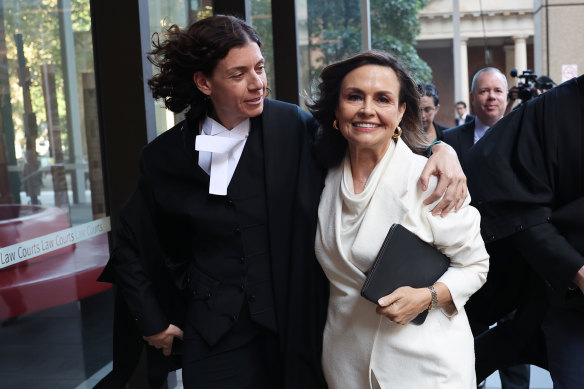 Sue Chrysanthou, SC, hugs Lisa Wilkinson as they emerge from the Federal Court on Monday.