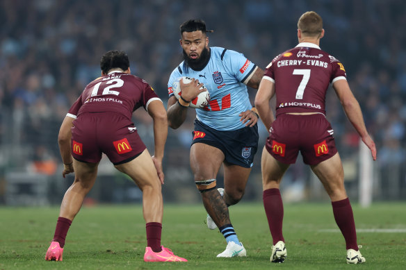 Payne Haas charges into the Queensland defence during game one of the 2024 Origin series.