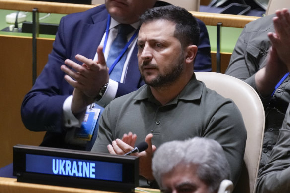 Members of the Ukrainian delegation, including President Volodymyr Zelensky, applaud as United States President Joe Biden speaks during the 78th session of the United Nations General Assembly at United Nations headquarters.