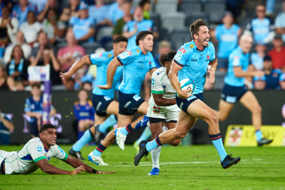 Jake Gordon makes a break for the Waratahs against the Fijian Drua at CommBank Stadium.