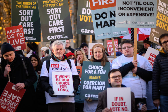 Supporters of the “Not Dead Yet” campaign, which opposes the Assisted Dying bill, react as news breaks that the bill has passed the first stage.
