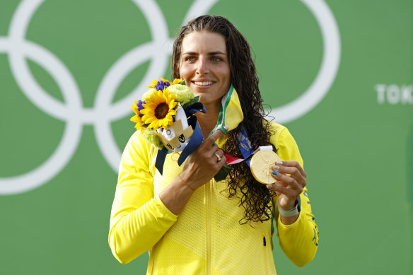 Jessica Fox celebrates with her gold medal in Tokyo.