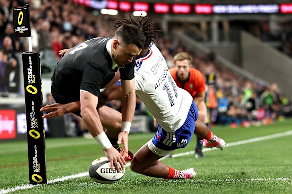 Will Jordan of the New Zealand All Blacks scores a try.
