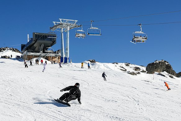 A snowboarder on the new Legends Run near the top of the Mt Perisher 6 chairlift.