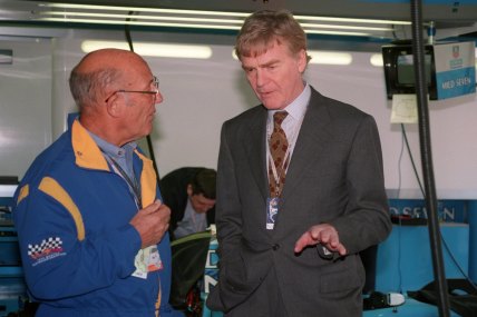 Max Mosley talking to racing legend Stirling Moss (left) at the Australian Grand Prix in 1998.