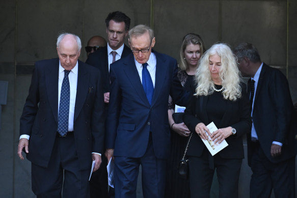 Former NSW premier Bob Carr (centre) with former prime minister Paul Keating and his former wife Annita van Iersel and current NSW Premier Chris Minns and his wife Anna leave the requiem mass for Helena Carr.