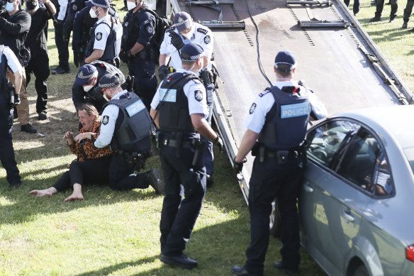 Police enter the makeshift campsite associated with the ‘Convoy to Canberra’.