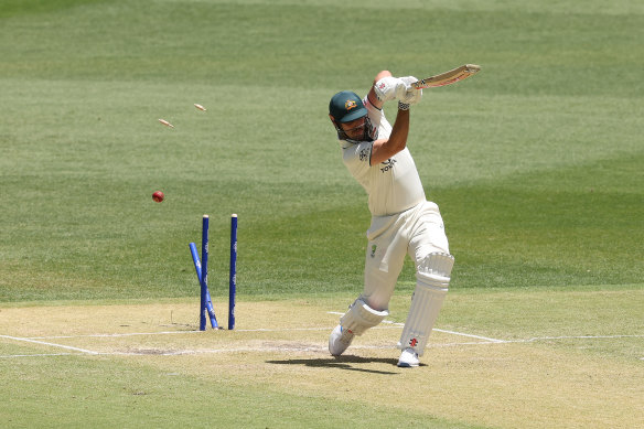 Mitchell Marsh is bowled for 90.
