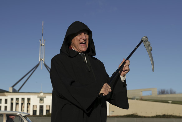 Bob Katter dressed as the Grim Reaper during a press conference in 2020 to discuss a motion supporting the re-establishment of an Australian car manufacturing industry.