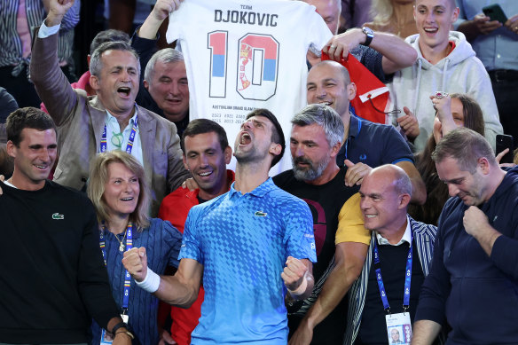Novak Djokovic celebrates with his team, including Goran Ivanisevic (right, with yellow sleeves), after winning the Australian open.