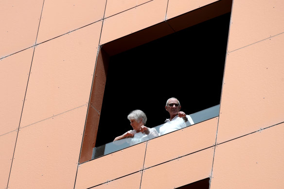 Quarantined hotel guests on the balcony of the Peppers Waymouth Adelaide hotel on Wednesday 