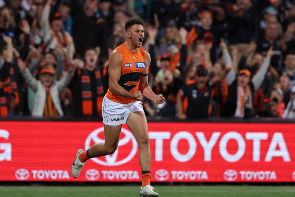 Giant Jake Riccardi celebrates a goal in front of a small band of hardy GWS supporters who braved the trip to the Adelaide Oval for Saturday night’s semi-final.