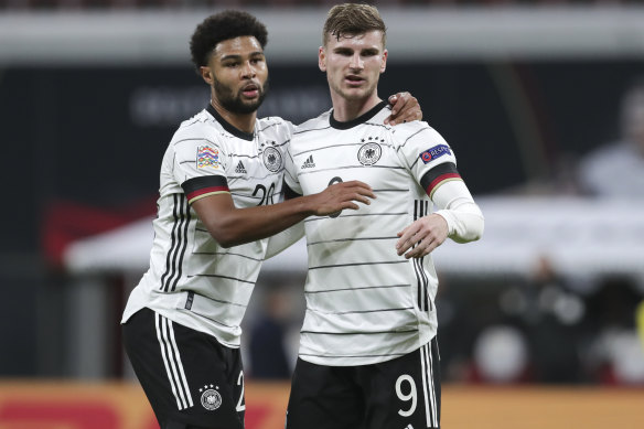Timo Werner (right) celebrates with German teammate Serge Gnabry.