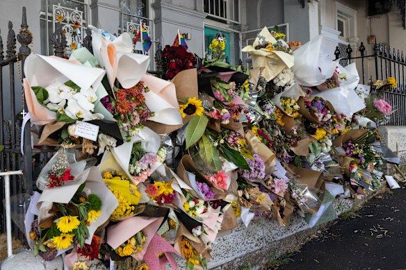 Flower tributes outside the Paddington home of Jessie Baird, where the couple were allegedly murdered in February 2024.
