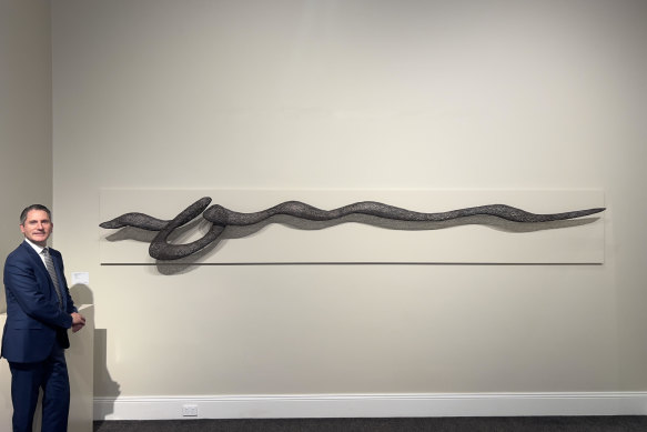Geoffrey Smith, of auctioneers Smith and Singer, with Tide, by the late Sydney-based sculptor, Bronwyn Oliver.