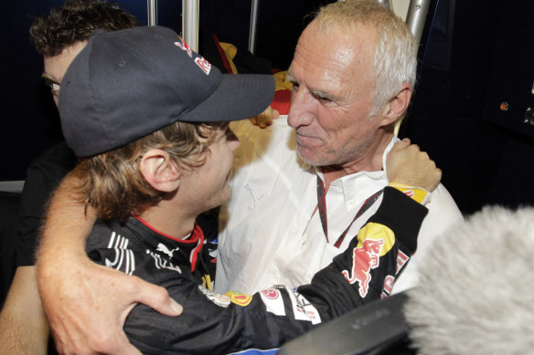 Mateschitz, team owner of Red Bull, celebrates with driver Sebastian Vettel after Vettel became Formula 1 world champion in 2010.